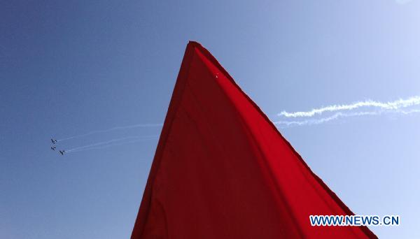 An aerobatic team performs during the AVEX International Air Show at the Sharm El Sheikh airport, Egypt, Nov. 8, 2010.