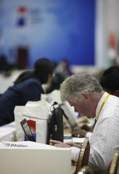 A journalist works in the Convention and Exhibition Center (COEX) in Seoul, capital of the Republic of Korea (ROK), Nov. 9, 2010. 
