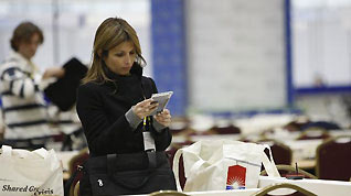 A journalist works in the Convention and Exhibition Center (COEX) in Seoul, capital of the Republic of Korea (ROK), Nov. 9, 2010.