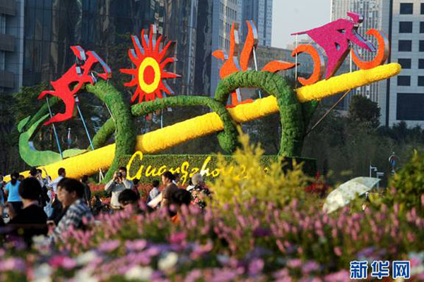 This photo shows off landscaping themed for the 16th Asian Games in Guangzhou in southeastern China&apos;s Guangdong Province on Nov.8, 2010. Guangzhou has dressed up itself with flowerbeds, sculptures and mascots to embrace the upcoming grand festival.