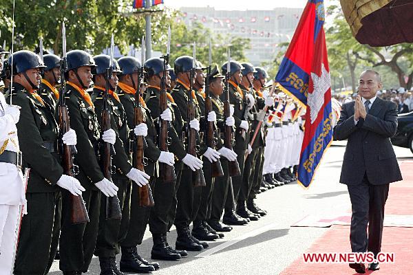 Cambodian King Norodom Sihamoni inspects the guard of honour during a ceremony to celebrate the 57th anniversary of independence of Cambodia in Phnom Penh, on Nov. 9, 2010.