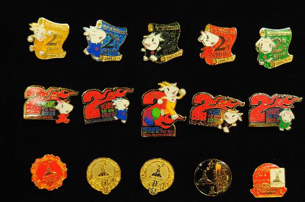 The Complete Lapel Pin Collection for the 16th Asian Games is released in Guangzhou, south China's Guangdong Province, Nov. 10, 2010. 