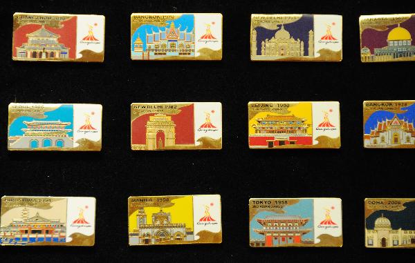 The Complete Lapel Pin Collection for the 16th Asian Games is released in Guangzhou, south China's Guangdong Province, Nov. 10, 2010.