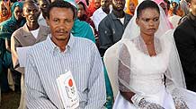 A couple attend a group wedding held for 500 youths from Northern and Southern Sudan in Omdurman town, near Khartoum, capital of Sudan, Nov. 13, 2010.