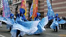 Costumed performers dance during the Lord Mayor's Show in the City of London, capital of Britain, Nov. 13, 2010.