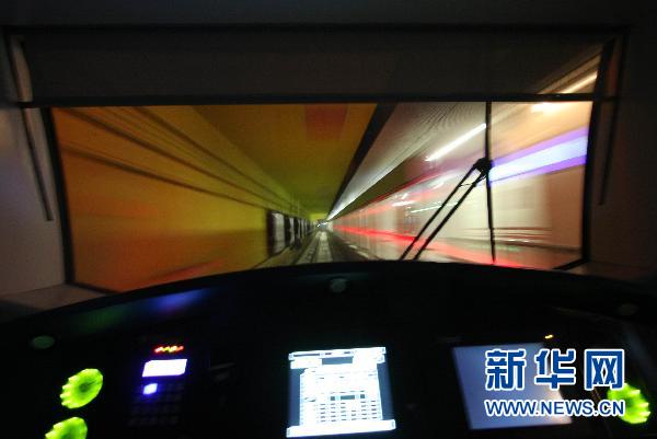 The view from the driver&apos;s cab as a train speeds through a station during a trial run of the new Yizhuang subway line in Beijing.
