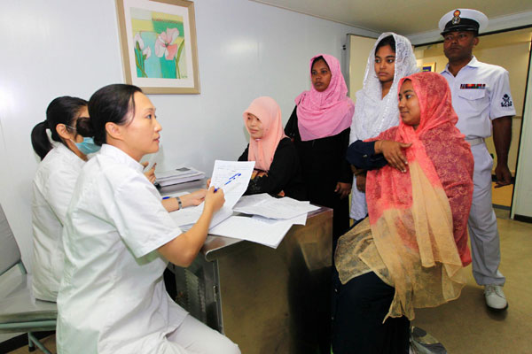 Gynecologists of the Peace Arkhospital ship provide medical care for local women.