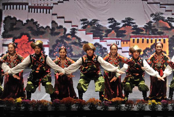 Tibetan artists perform during a show of Tibetan music and dance in Spanish capital Madrid Nov. 15, 2010. 