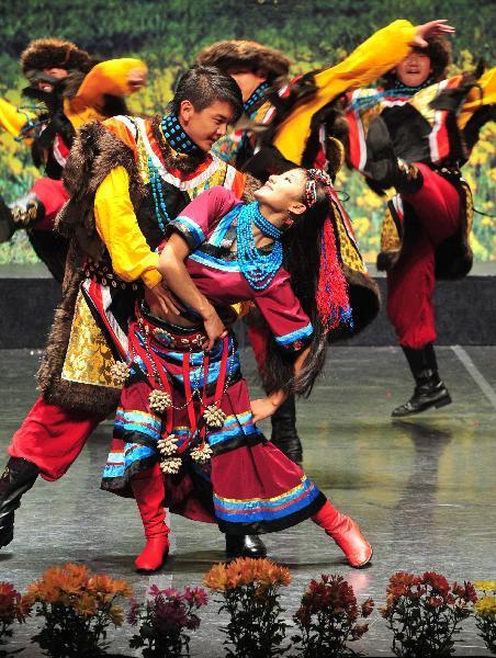 Tibetan artists perform during a show of Tibetan music and dance in Spanish capital Madrid Nov. 15, 2010.