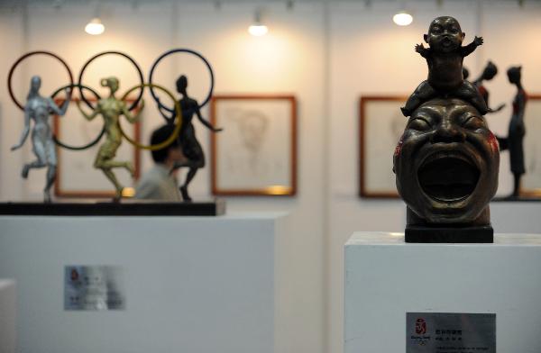 Photo taken on Nov. 18, 2010 shows the Olympic creative sculpture exhibition at the third China International Copyright Expo in Beijing, capital of China. 