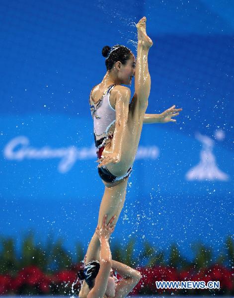 Team DPRK perform during the women's synchronised swimming team free routine final at the 16th Asian Games in Foshan, south China's Guangdong Province, Nov. 20, 2010.