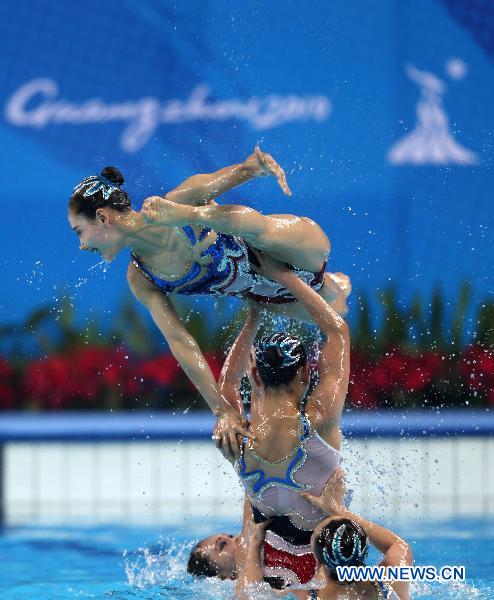 Team DPRK perform during the women's synchronised swimming team free routine final at the 16th Asian Games in Foshan, south China's Guangdong Province, Nov. 20, 2010. 