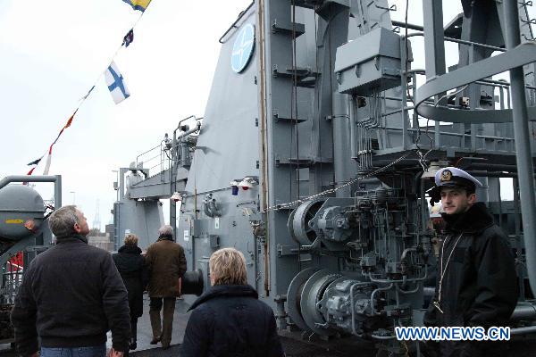 Visitors board the Polish mine countermeasures vessel called 'Admiral Xawery Czernicki' at the navy base in Zeebrugge, Belgium, Nov. 21, 2010. 
