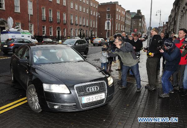 Irish Agriculture Minister Brendan Smith (in the car) arrives at the Government Buildings for a cabinet meeting, in Dublin, Ireland, Nov. 21, 2010. 