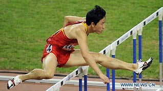 China's hurdlist Liu Xiang competes during the men's 110m hurdles round 1 heat of Athletics at the 16th Asian Games, Nov. 22, 2010. Liu advanced to the final with 13.48 seconds.