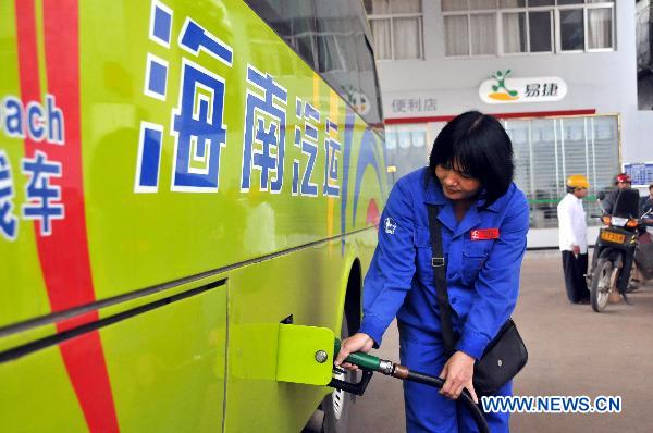 A worker of gas station refuels 'B5' biodiesel for a vehicle in Chengmai County, south China's Hainan Province, Nov. 22, 2010.