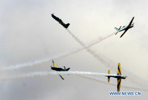 Military aircrafts perform aerobatics in the sky during the 'Las Palmas 2010' festival in Lima, capital of Peru, on Nov. 21, 2010. 