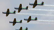 Military aircrafts perform aerobatics in the sky during the 'Las Palmas 2010' festival in Lima, capital of Peru, on Nov. 21, 2010.