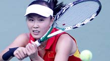 Peng Shuai of China returns the ball during the women's singles final of Tennis against Akgul Amanmuradova of Uzbekistan at the 16th Asian Games in Guangzhou, south China's Guangdong Province, Nov. 23, 2010.Peng Shuai won 2-0 and got the gold medal.