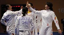 Xu Anqi (R1) of China celebrates with teammates during the women's team epee semifinal against South Korea at the 16th Asian Games in Guangzhou, south China's Guangdong Province, Nov. 23, 2010. China won the match by 43-28 and entered the final.