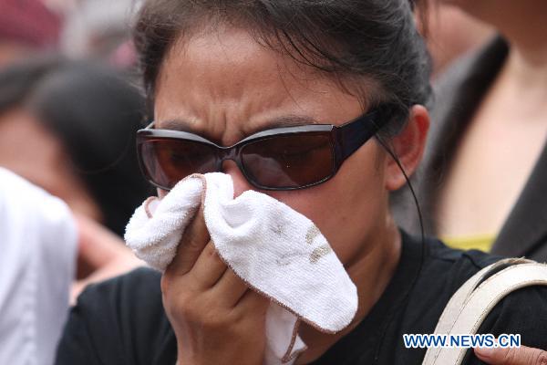 A relative of a victim of the Maguindanao Massacre cries during a commemoration for the first anniversary of the massacre in Maguindanao on Nov. 23, 2010.