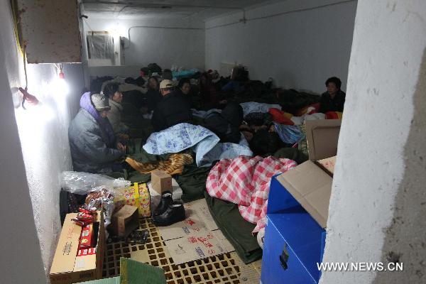 Local residents take refuge in an air raid shelter on the Yeonpyeong Island hit by artillery shells the Democratic People&apos;s Republic of Korea (DPRK) fired a day ago, Nov. 24, 2010. 