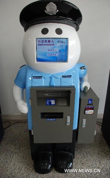 The exit and entry service robot named 'A Pang' is seen in Quanzhou City's exit and entry administration, southeast China's Fujian Province, Nov. 24, 2010.