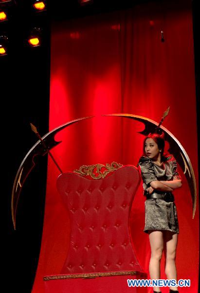 An actress performs on stage at the Nine Theater in Beijing, capital of China, Nov. 24, 2010. 