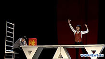 Actors perform on stage at the Nine Theater in Beijing, capital of China, Nov. 24, 2010. 'Instruction of Destroying The Earth', a comedy drama about hostile pollution and environmental protection, is aimed at raising the green awareness in China.