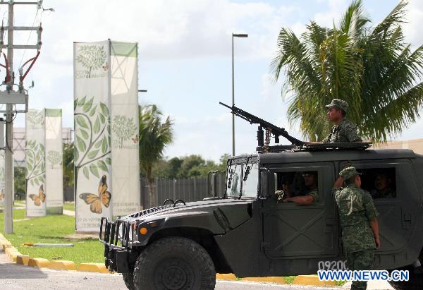 Mexican soldiers guard at the venue of the upcoming United Nations Climate Change Conference in Cancun, Mexico, on Nov. 24, 2010. 