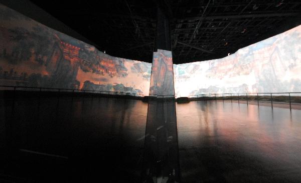 The picture of 'Riverside Scene at Qingming Festival' is under debugging at Shanghai Expo's China Pavilion in Shanghai, east China, Nov. 25, 2010.