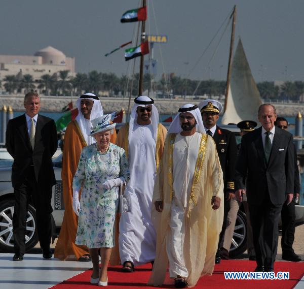 Britain&apos;s Queen Elizabeth II (L, front) walks with Sheikh Mohammed bin Rashed al-Maktoum (R, front), vice president and prime minister of the United Arab Emirates (UAE) and ruler of Dubai emirate, during a ceremony to unveil the design of the Zayed National Museum which will be built on Saadiyat Island off the coast of Abu Dhabi in partnership with the British Museum, in Abu Dhabi on Nov. 25, 2010.