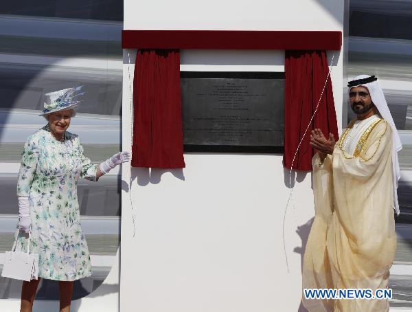 Britain&apos;s Queen Elizabeth II (L) and Sheikh Mohammed bin Rashed al-Maktoum, vice president and prime minister of the United Arab Emirates (UAE) and ruler of Dubai emirate, unveil a commemorative plaque in Abu Dhabi to mark the beginning of construction of the Zayed National Museum which will be built on Saadiyat Island off the coast of Abu Dhabi in partnership with the British Museum, Nov. 25, 2010. 