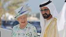 Britain's Queen Elizabeth II (L) is escorted by Sheikh Mohammed bin Rashed al-Maktoum, vice president and prime minister of the United Arab Emirates (UAE) and ruler of Dubai emirate, in Abu Dhabi on Nov. 25, 2010.