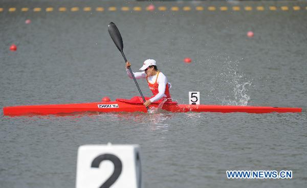 China's Zhou Yu competes during the women's kayak single 500 final at the 16th Asian Games in Guangzhou, southeast China's Guangdong Province, Nov. 26, 2010. Zhou Yu won the gold medal in the time of 1 minute and 48.912 seconds. [