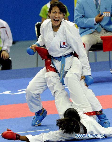 Japan's Miyamoto Yu (back) competes against Malaysia's Yamini Gopalasamy during the women's -61kg final of Karate at the 16th Asian Games in Guangzhou, south China's Guangdong Province, Nov. 26, 2010. 