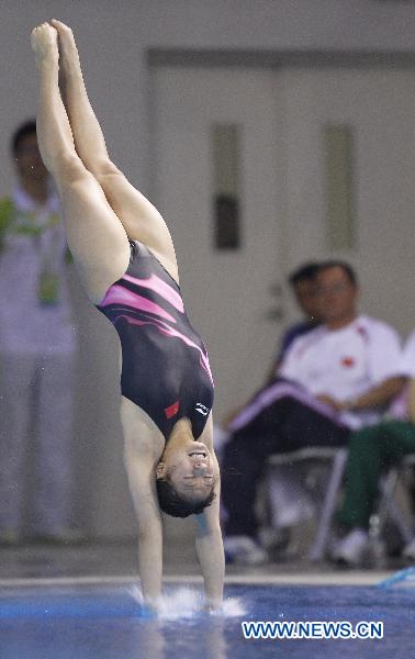 China's He Zi competes during the women's 3m springboard final of Diving event at the 16th Asian Games in Guangzhou, south China's Guangdong Province, Nov. 26, 2010.