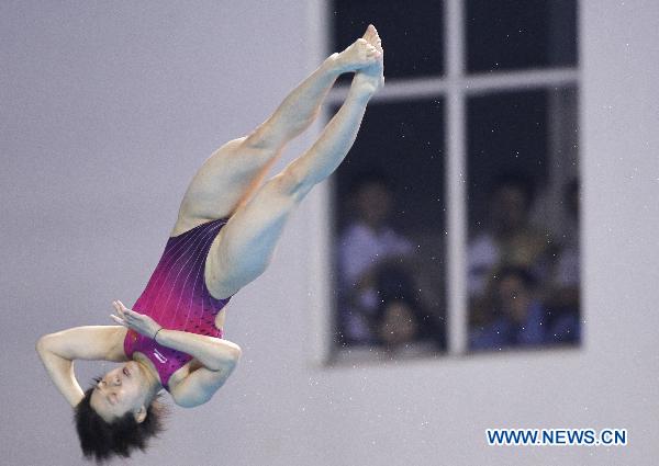 China's Shi Tingmao competes during the women's 3m springboard final of Diving event at the 16th Asian Games in Guangzhou, south China's Guangdong Province, Nov. 26, 2010. 