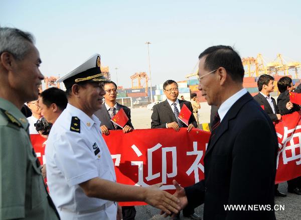 Chinese Ambassador to Saudi Arabia Yang Honglin (R) greets Wei Xueyi (2nd L), commander of China's sixth naval escort flotilla, in Jedda port, west Saudi Arabia, Nov. 27, 2010
