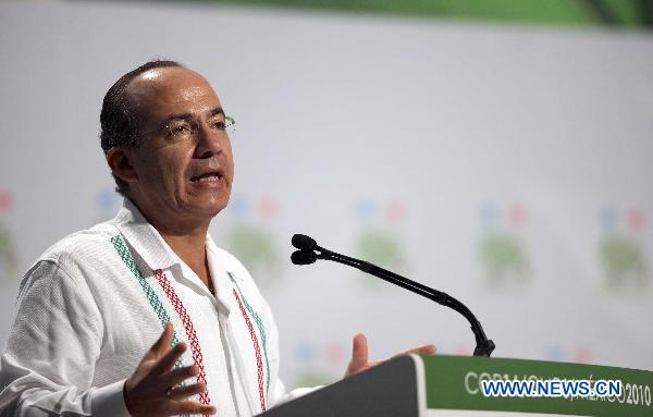 Mexican President Felipe Calderon addresses the opening session of the United Nations Climate Change Conference (COP-16) in Cancun, Mexico, Nov. 29, 2010. 