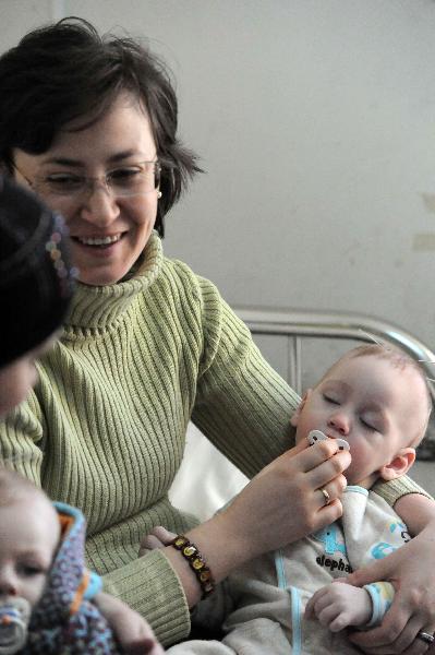 An infant receiving acupuncture treatment is seen in a hospital in Harbin, capital of northeast China's Heilongjiang Province, Nov. 30, 2010.