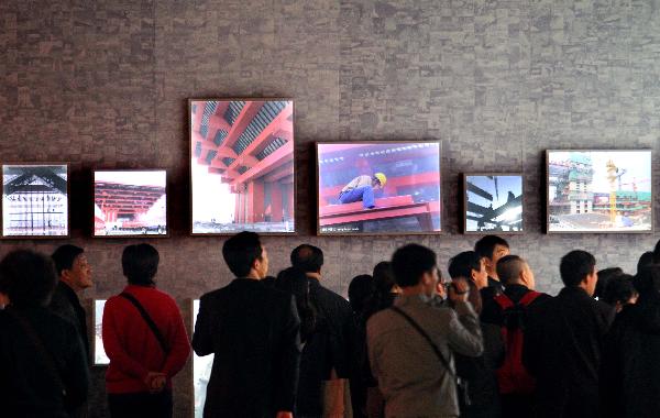 Visitors view the China Pavilion retrospect exhibition at China Pavilion of the World Expo in Shanghai, east China, Dec. 1, 2010. 