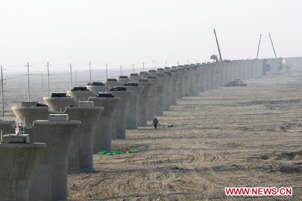 Photo taken on Nov. 30, 2010 shows bridge pillars of the Lanzhou-Xinjiang Railway crossing the wind field, which is dubbed as 'ghost' for that windstorms of above 100 km per hour often running through it which once overthrown a train in 2007, in Turpan, northwest China's Xinjiang Uygur Autonomous Region.
