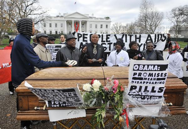 Activists hold a mock funeral for people who died of the HIV/AIDS in the past year, marking the World AIDS Day and calling for US President Barack Obama to fulfill his promise to fund global AIDS, in front of the White House in Washington D.C., capital of the United States, Dec. 1, 2010.