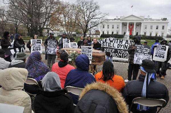Activists hold a mock funeral for people who died of the HIV/AIDS in the past year, marking the World AIDS Day and calling for US President Barack Obama to fulfill his promise to fund global AIDS, in front of the White House in Washington D.C., capital of the United States, Dec. 1, 2010.