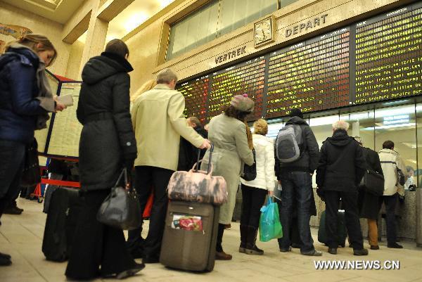 Commuters line up for tickets at the Central Station in Brussels, capital of Belgium, Dec. 2, 2010.