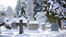 Snow covers the gravestones in Geneva, Switzerland, Dec. 2, 2010. Weather turned fine in Geneva on Thursday after the continuous snowfall.
