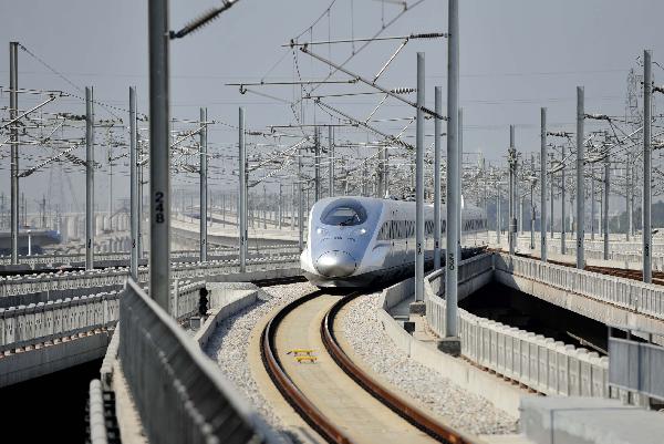 A train of CRH380A of China Railway High-Speed (CRH) enters into the Guangzhou south railway station in Guangzhou, capital of south China's Guangzhou Province, Dec. 3, 2010.