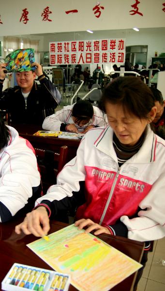 Mentally retarded people participate in a skill competition in Karamay, northwest China's Xinjiang Uygur Autonomous Region, on Dec. 3, 2010, the 19th International Day of Disabled Persons.