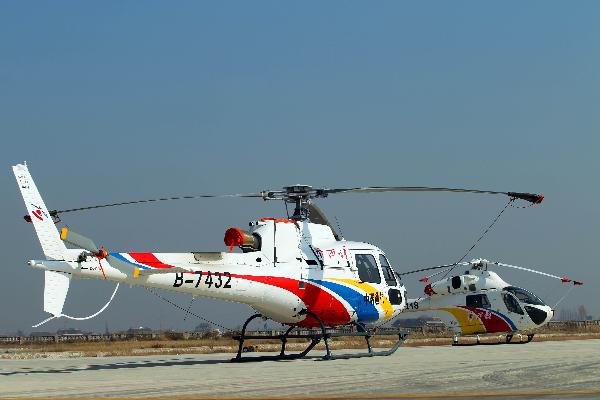 Photo taken on Dec. 5, 2010 shows two helicopters purchased by Huaxi Village for tourism, in Jiangyin, east China's Jiangsu Province. 